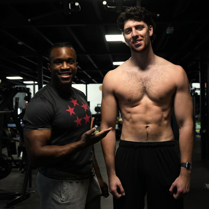 John coaching a client one-to-one in the gym